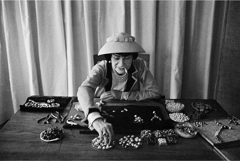 Coco Chanel creating new jewelry in her Parisian studio, 1957