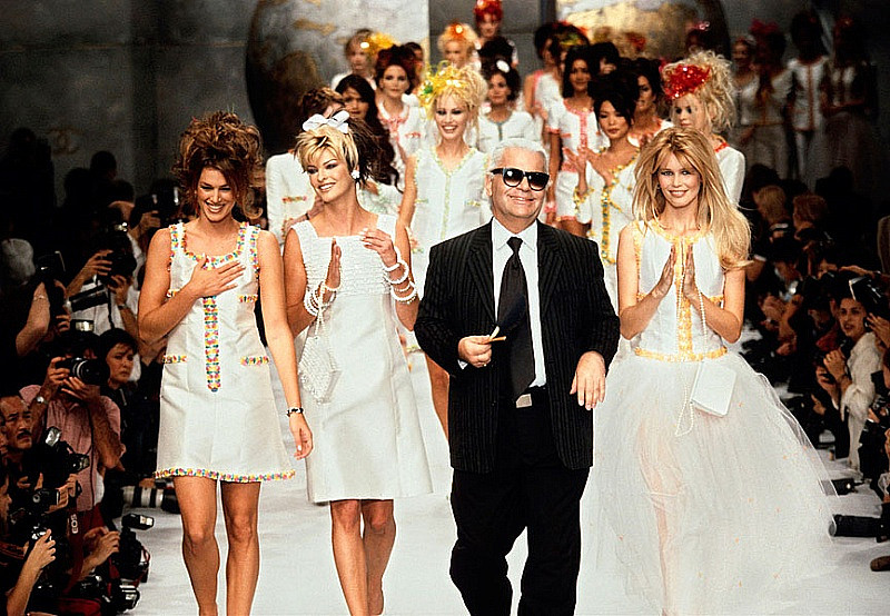 Karl surrounded by his favourite models during Chanel fashion show, 1990s.