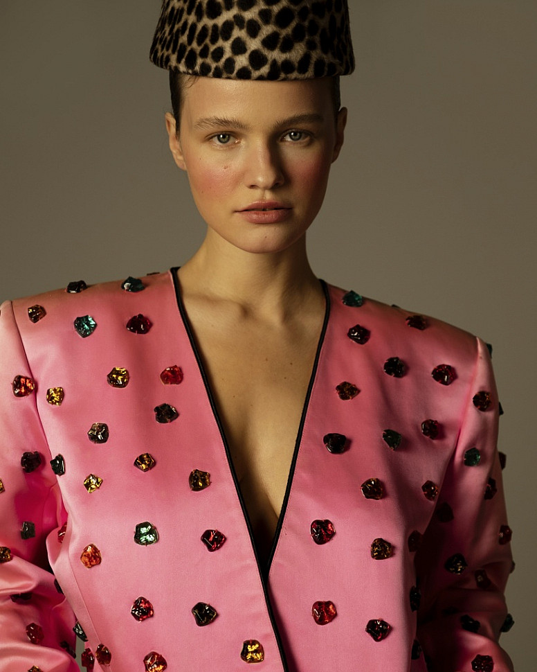 Model wearing haute couture Yves Saint Laurent jacket with multi-coloured crystals.