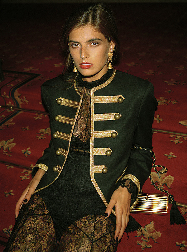 Dasha Malygina wearing Chanel clip-on earrings and Yves Saint Laurent clutch