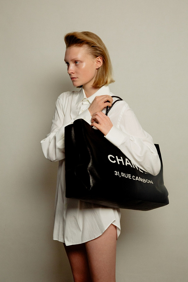 Model wearing Chanel big shopper bag