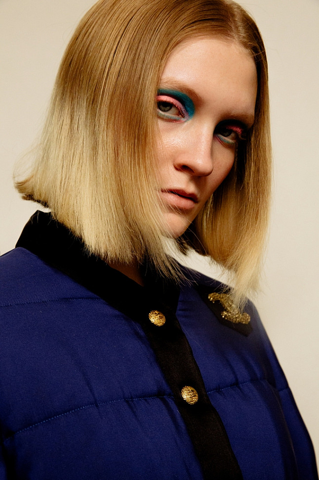 Model wearing Chanel quilted silk bomber jacket.