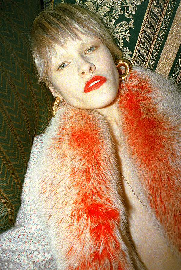 Chanel tweed coat with fox fur and Napier clip-on earrings