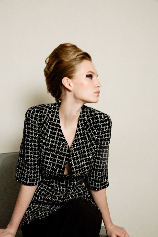 Model wearing Chanel chequered tweed jacket