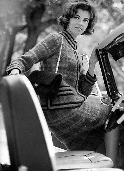 The model wearing Chanel tweed jacket and Chanel 2.55 classic flap bag, 1960s