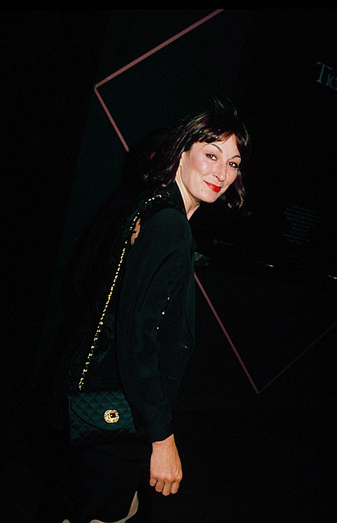 Anjelica Huston with a Chanel satin bag