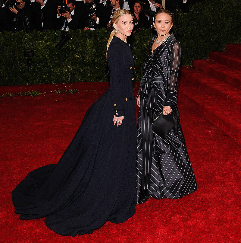 Mary-Kate Olsen wearing a vintage Chanel dress and Ashley Olsen wearing a vintage Gianfranco Ferré dress at the MET Ball